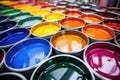 automotive paint cans in a variety of colors