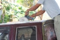 Automotive paint technician using grinder machine with wax on the top of pickup , A part of the procedure to make a new color car