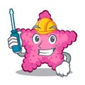 Automotive pink starfish animal on mascot sand