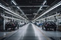 automotive plant, with row of cars in various stages of construction