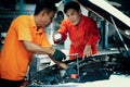 Automotive service mechanic inspect and diagnose car engine. Oxus