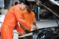 Automotive service mechanic inspect and diagnose car engine. Oxus