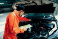 Automotive service mechanic inspect and diagnose car engine. Oxus