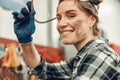 Automotive technician looking in front of her