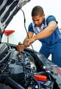 Automotive Technician Works On Car Engine REVISED