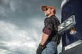 Caucasian Trucker Driver in Front of His Retro Semi Truck Royalty Free Stock Photo