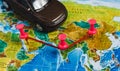 Automotive Travel Destination Points on World Map Indicated with Colorful Thumbtacks, Rope and Shallow Depth of Field. Royalty Free Stock Photo