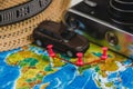 Automotive Travel Destination Points on World Map Indicated with Colorful Thumbtacks, Rope and Shallow Depth of Field. Royalty Free Stock Photo