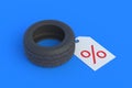 Automotive tyres near label with percent symbol. Special offer. Hot discounts