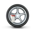 Automotive wheel with a tag Royalty Free Stock Photo