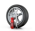 Automotive wheel with tools Royalty Free Stock Photo