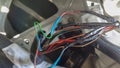 automotive wiring harness with traces of repair and new damage to the wires