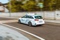 autonomous car of sber autotech moving fast on the street. self-driving Kia Ceed Sportswagon in motion Royalty Free Stock Photo