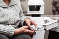 Autonomous caregiver robot is holding a insulin syringe Royalty Free Stock Photo