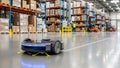 Autonomous cleaning robot efficiently cleans floors in a large warehouse environment today Royalty Free Stock Photo