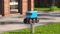 Autonomous delivery robot drives along the street