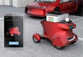 Autonomous delivery robot in front of the garage waiting for picking pizza