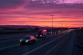 autonomous electric truck fleet on highway at dusk