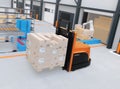 Autonomous forklift carrying pallet of goods in modern logistics center