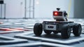 Autonomous mobile robot moving on industrial floor with red lights