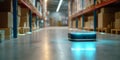 Autonomous robot navigating warehouse aisle with shelves stocked with boxes and packages in industrial storage environment Royalty Free Stock Photo