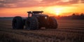 an autonomous tractor driving through a field during sunrise, planting crops with precision Royalty Free Stock Photo