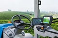 Autonomous tractor working in green tea field, Future technology with smart agriculture farming concept Royalty Free Stock Photo