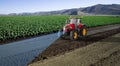 Autonomous tractor working in lettuce field, Future 5G technology with smart agriculture farming concept, 3drender Royalty Free Stock Photo