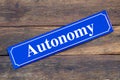 Autonomy street sign on wooden background