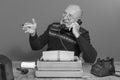 Autor from the past. Desk with telephone and typewriter. Vintage. Writer editor. black and white Royalty Free Stock Photo