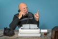Autor of the past. Journalist at work. Desk with telephone and typewriter. Vintage. Writer editor Royalty Free Stock Photo
