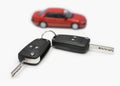 Two ignition keys and a red car Royalty Free Stock Photo