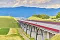 Autostrada highway in Europe. D1 magistal near Spissky hrad, arched bridge. Motorway viaduct bridge, Spis region, Slovakia. Royalty Free Stock Photo