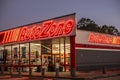 Autozone auto parts store at night corner view