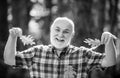 Autumn and active holidays. Senior man strolling in a park in autumn. Active senior man having fun and playing with the Royalty Free Stock Photo