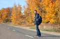 Autumn adventure travel concept. Handsome hipster man in casual Royalty Free Stock Photo