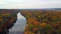 Autumn aerial above river with colorful riverbanks