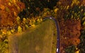 Autumn aerial drone view on curvy road with cars Royalty Free Stock Photo