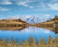 Autumn alpine Kleiner Paarsee or Paarseen lake, Land Salzburg, Austria. Alps Hochkonig rocky mountain group view in far Royalty Free Stock Photo