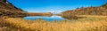 Autumn alpine Kleiner Paarsee or Paarseen lake, Land Salzburg, Austria. Alps Hochkonig rocky mountain group view in far Royalty Free Stock Photo