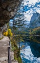 Autumn alpine view. Peaceful mountain lake with clear transparent water and reflections and ferrata stairs. Gosauseen or Vorderer Royalty Free Stock Photo