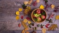 Autumn arrangement of leaves, apples and berries on a wooden background with free space for text. Top view, concept of Royalty Free Stock Photo