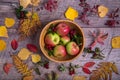 Autumn arrangement of leaves, apples and berries on a wooden background with free space for text. Top view, concept of Royalty Free Stock Photo