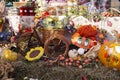 Autumn arrangement with painted pumpkin, fruits, vegetables, and flowers, at a market fair Royalty Free Stock Photo