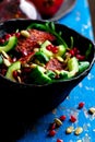 AUTUMN ARUGULA SALAD WITH CARAMELIZED SQUASH with POMEGRANATE GINGER VINAIGRETTE