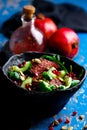 AUTUMN ARUGULA SALAD WITH CARAMELIZED SQUASH with POMEGRANATE GINGER VINAIGRETTE