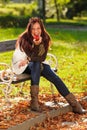 Autumn attractive woman eat apple sunset park Royalty Free Stock Photo