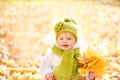 Autumn Baby, Happy Kid Outdoors Portrait with Yellow Fall Leaves Royalty Free Stock Photo