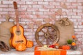 Autumn background with Rye, wheat, with yellow maple leaves, pumpkins, red apples. Frame of fall harvest on aged wood Royalty Free Stock Photo