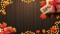 Autumn background with brown wooden wall, garland frame, autumn leafs and gift box, top view Royalty Free Stock Photo